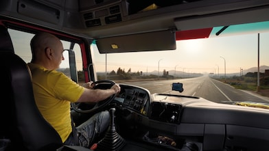 truck driver driving on empty road