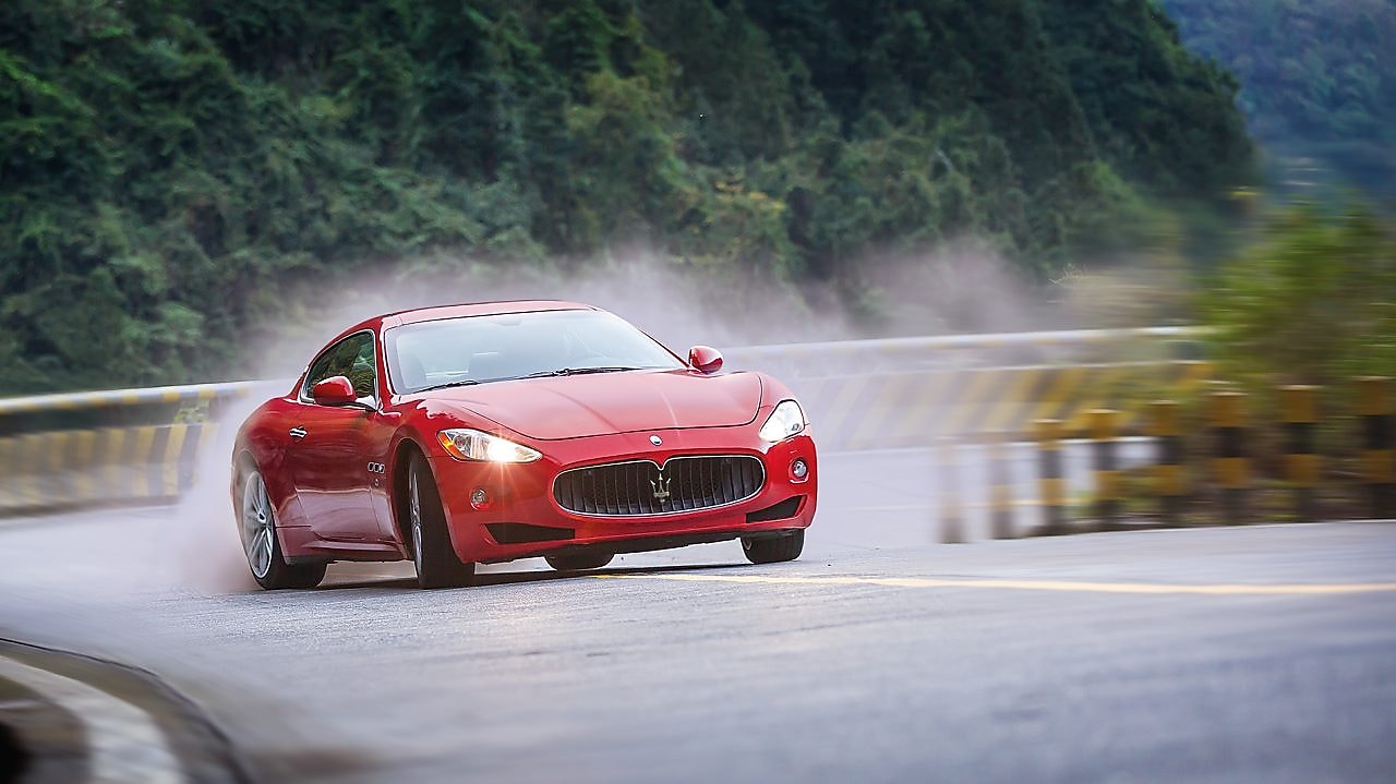A red Maserati speeds uphill in the Shell Helix Ultra film We Know Why You Drive