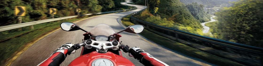 Man riding a bike which is using the Superior Engine Oil For Bikes