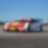 A red and white BMW race car sits on the track, exemplifying the Shell Helix Ultra and BMW’s Premium Technology Partnership
